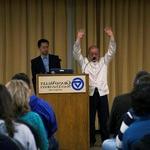 Master Victor Chiang with hands raised behind podium